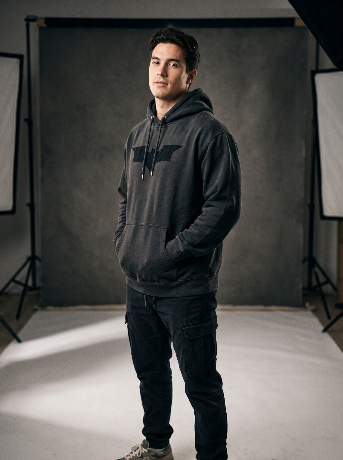 Model wearing IRON CULT Dark Knight charcoal hoodie