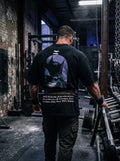 Iron Cult Dark Knight tee worn in an industrial gym