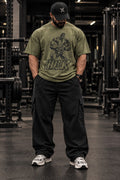 Iron Cult Hulk olive oversized tee modeled in gym, front view