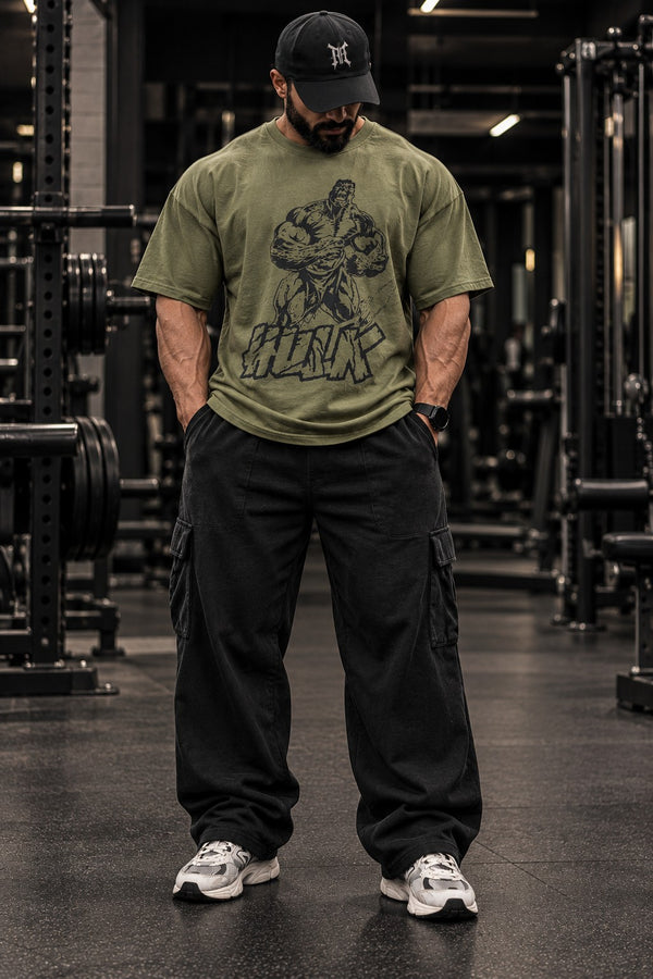 Iron Cult Hulk olive oversized tee modeled in gym, front view