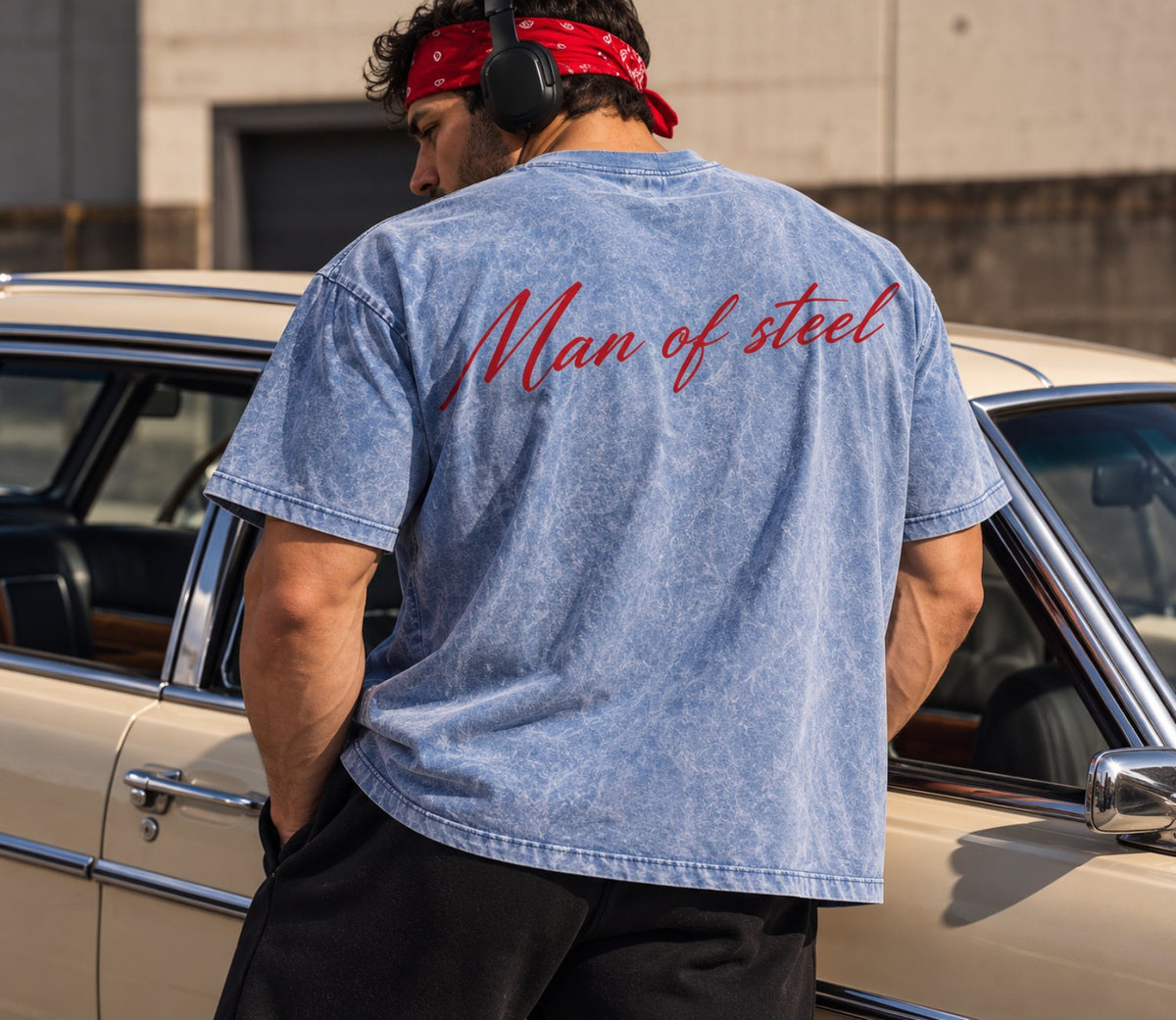 Back view of light blue acid-wash tee with Man of Steel script