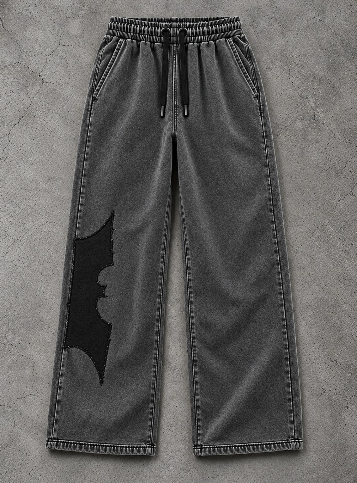 IRON CULT washed charcoal wide-leg trousers with clean black bat appliqué, no white dots